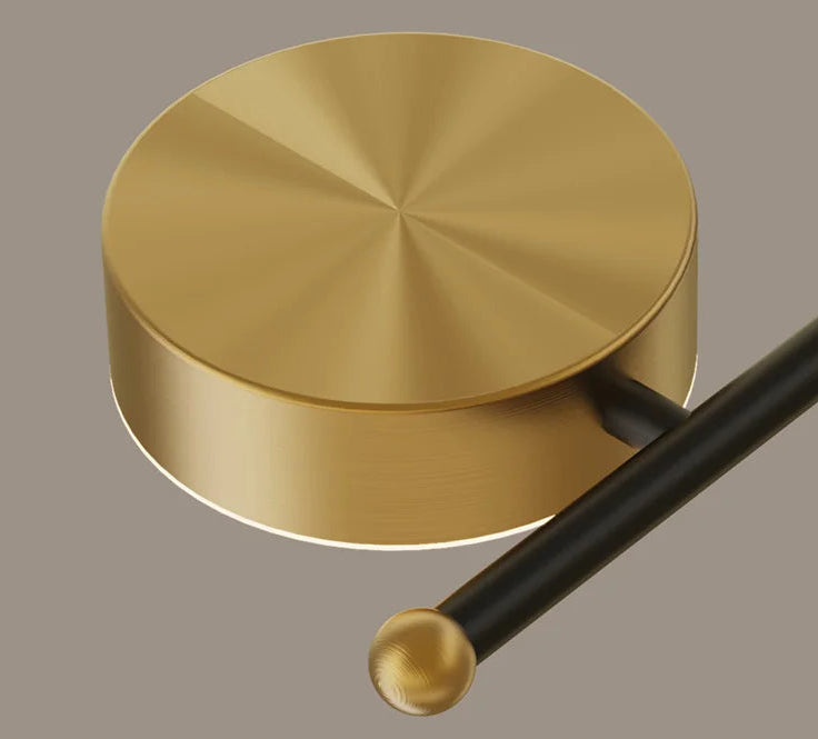 Gold drum beater on a gray background