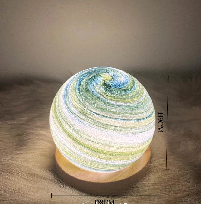 Decorative lamp with swirling pattern on a textured surface, showing dimensions.