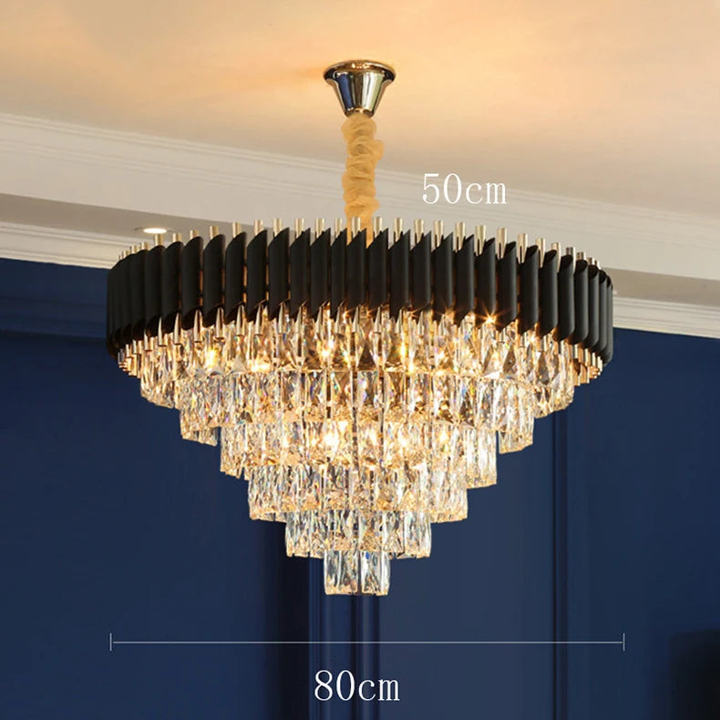 Chandelier with black and gold design against a blue wall