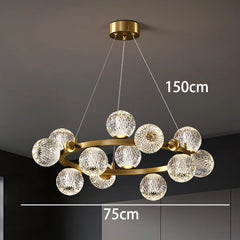 Chandelier with crystal balls and gold frame on a dark ceiling, measurements indicated.