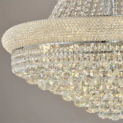 Close-up of a crystal chandelier with a gray background