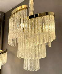 Luxurious chandelier with gold accents on a neutral background