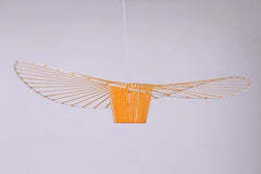 Decorative ceiling light fixture with a geometric design on a plain background