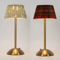 Two table lamps with pleated lampshades on a light gray background