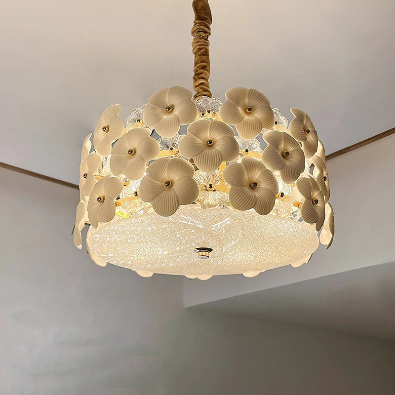 Decorative ceiling light fixture with floral design on a plain background