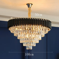 Chandelier with dimensions labeled against a blue wall