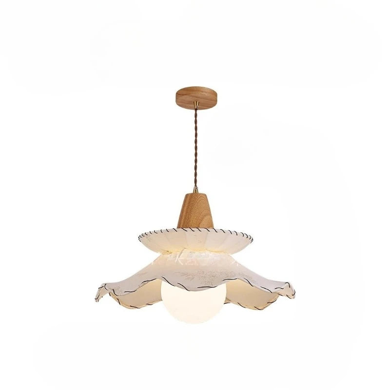 Pendant light with wooden fixture and white lampshade on a white background