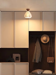 Modern interior with cabinets, a lamp, and hanging items.