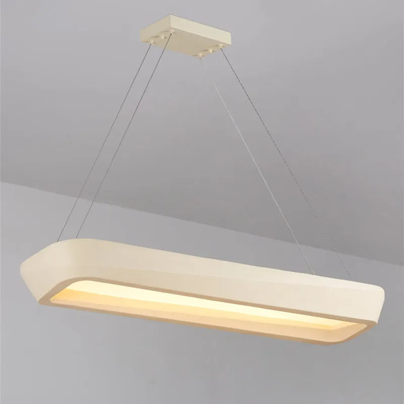 Modern pendant light fixture on a gray background