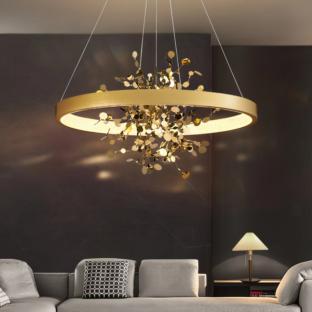 Close-up of the gold ring pendant light's intricate floral metalwork.