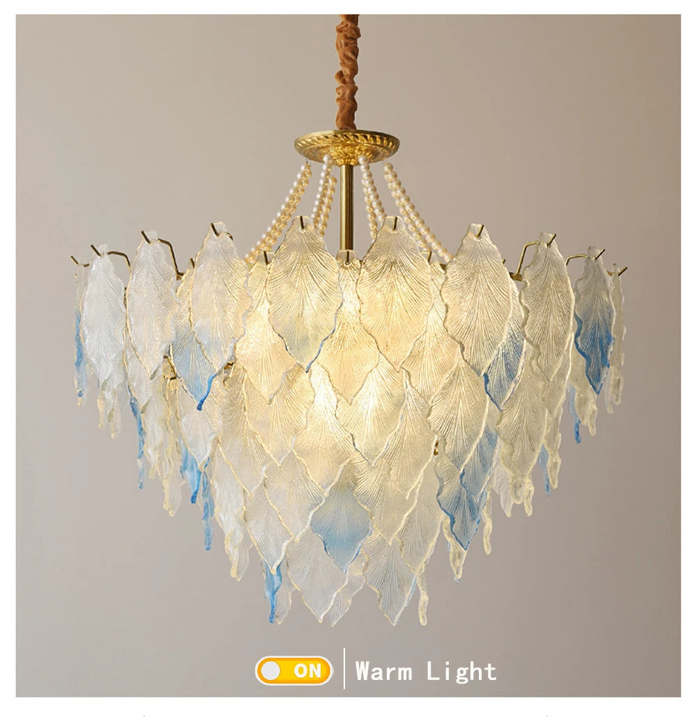 Decorative chandelier with leaf-like design on a plain background