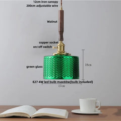 Green pendant light with labeled parts on a neutral background