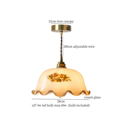 Pendant light with floral design on a white background