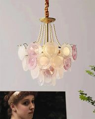 Decorative chandelier with floral design on a plain background
