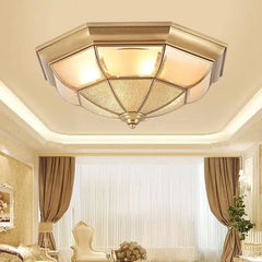 Ceiling light fixture in a room with curtains and decor