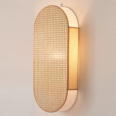 Woven wall light fixture on a plain wall