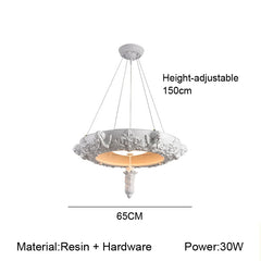 Decorative pendant light with height adjustable feature on a white background
