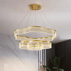 Modern gold pendant light fixture hanging from the ceiling.