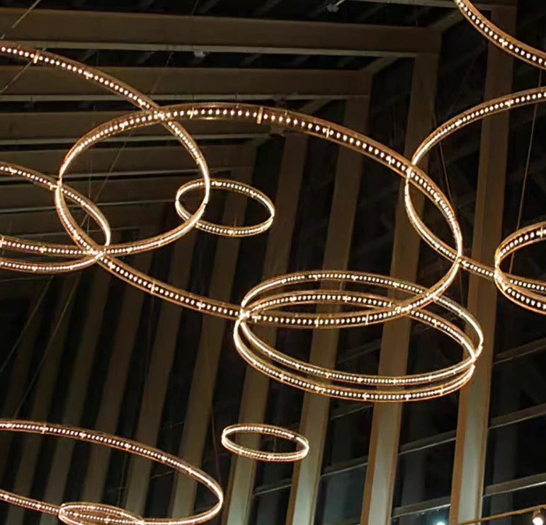 Modern chandelier with circular design hanging from a ceiling
