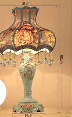 Decorative table lamp with floral design and measurements on a beige background