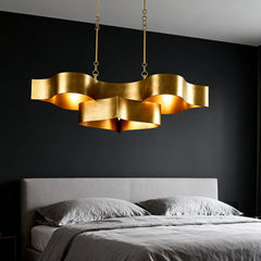 Detail of the gold finish and petal-like structure of the semi-flush ceiling light.