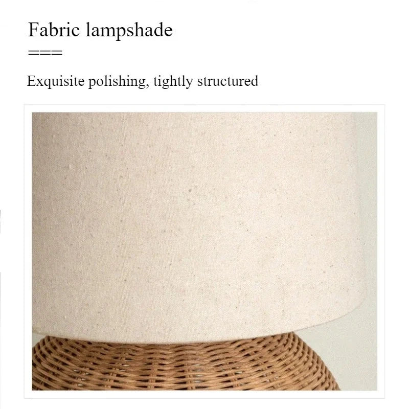 Close-up view of the texture of the fabric lampshade on the woven rattan table lamp.