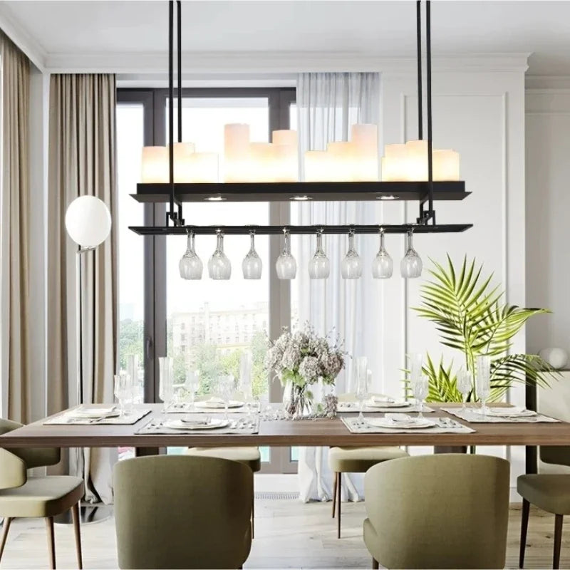 Modern dining room with a chandelier, table, chairs, and decor.