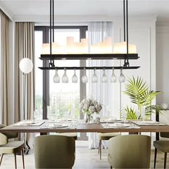 Modern dining room with a chandelier, table, chairs, and decor.