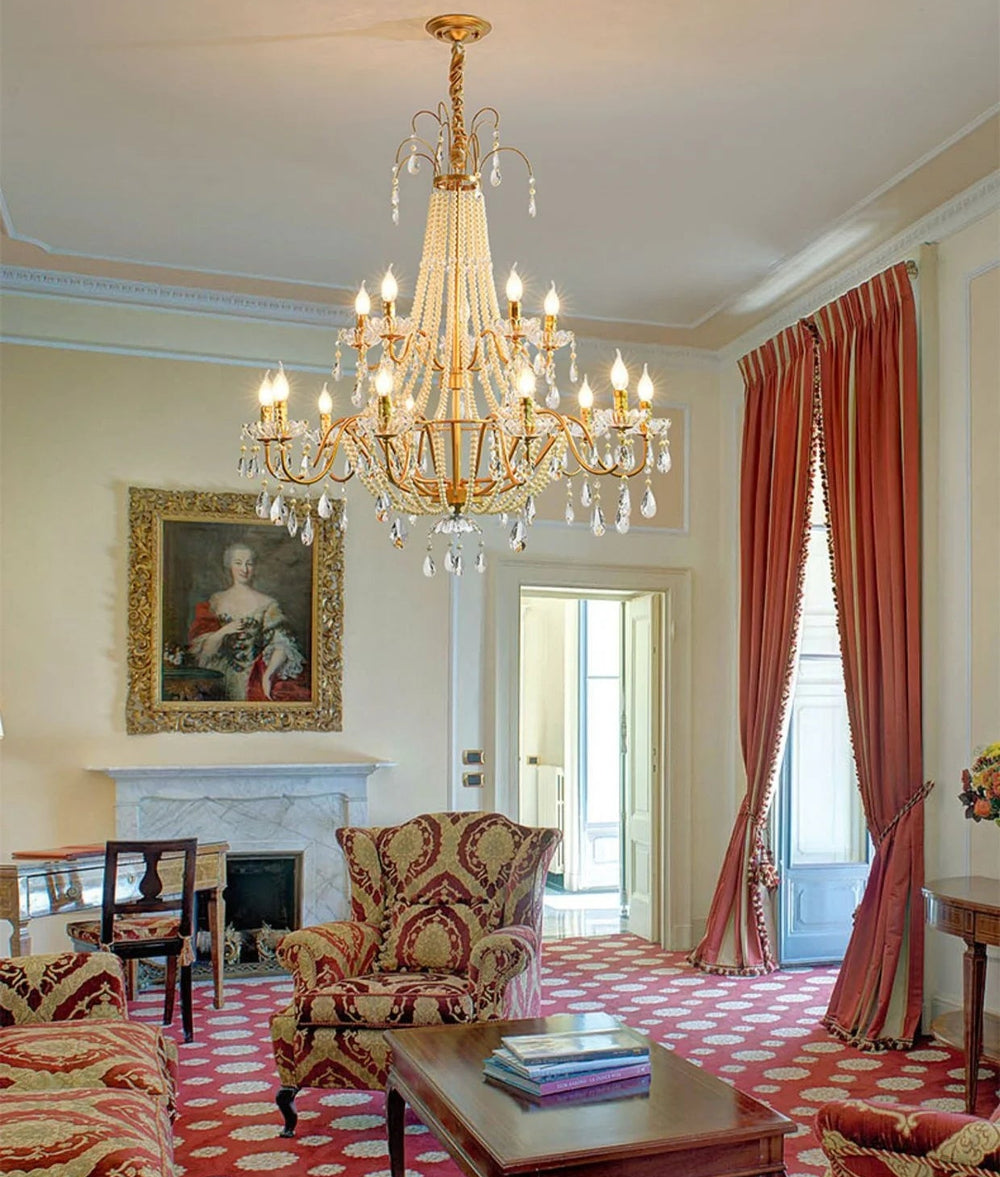 Luxurious living room with a chandelier, armchair, and decorative elements.