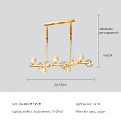 Gold pendant light with crystal elements on a gray background, featuring dimensions and material details.