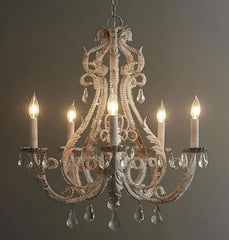 Decorative chandelier with five lights on a dark background