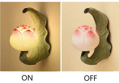 Lotus-shaped wall lamp showing 'ON' and 'OFF' states on a beige background