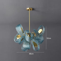 Blue glass chandelier with gold accents on a gray background