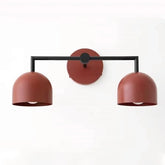 Wall-mounted lamp with three brown lampshades on a white background