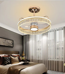 Modern ceiling light fixture in a bedroom setting with a bed and window in the background.