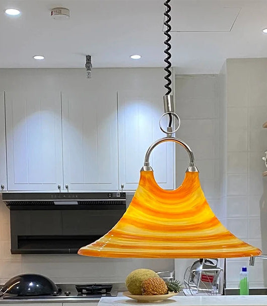 Modern kitchen featuring a unique pendant light.