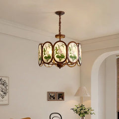 Bronze Chandelier with Frosted Glass and Green Leaf Floral Accents