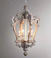 Decorative pendant light with intricate design on a gray background