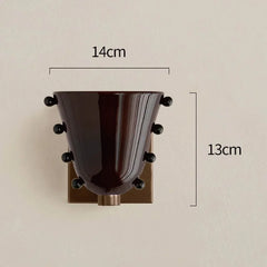 Wall-mounted decorative item with dimensions labeled on a beige background