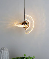 Modern pendant light with glass shade on a neutral background
