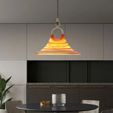 Stylish modern acrylic pendant chandelier suspended above a kitchen table