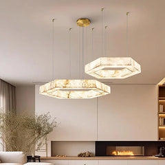 Three-ring marble pendant chandelier hanging in a modern living room