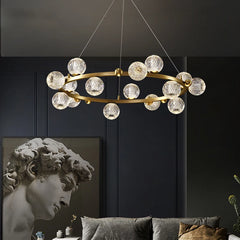 Alloy and glass globe chandelier lighting up a stylish living room
