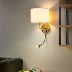 Wall-mounted lamp with a reading light on a neutral wall.