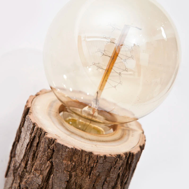 Light bulb on a wooden stump with a white background