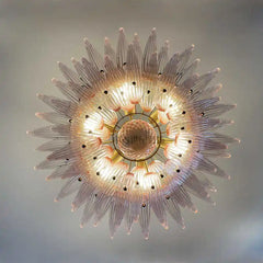 Decorative ceiling light fixture with a starburst design on a neutral background