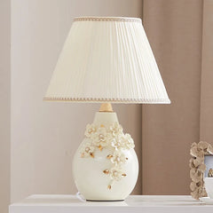 “Handmade ceramic lamp for bedside and desk lighting”