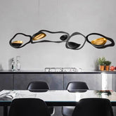 “Sculptural black and gold pendant lamp for modern dining”