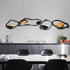 “Sculptural black and gold pendant lamp for modern dining”