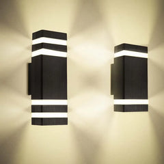 “Contemporary tower-style wall lamp with borosilicate glass diffusers.”